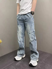 Distressed light blue vintage wide-leg jeans for him with paneling detail.