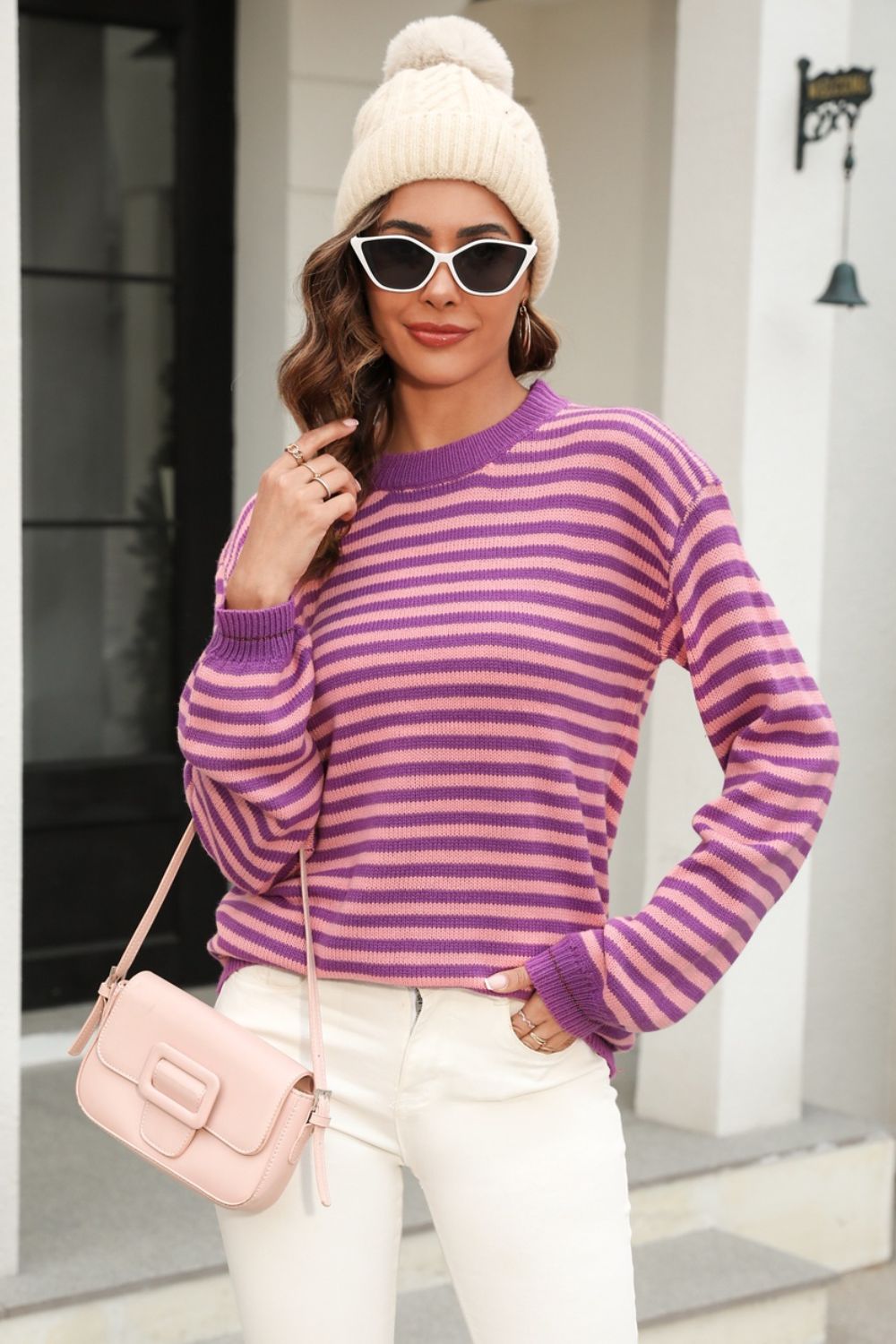 Classic Breton stripe knit crewneck sweater in pink and purple acrylic.