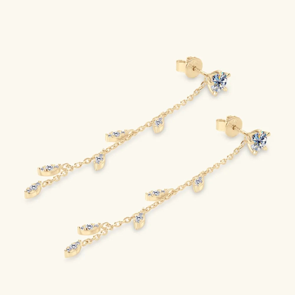 Gold dangling crystal vine earrings with delicate chain and marquise-shaped accents.