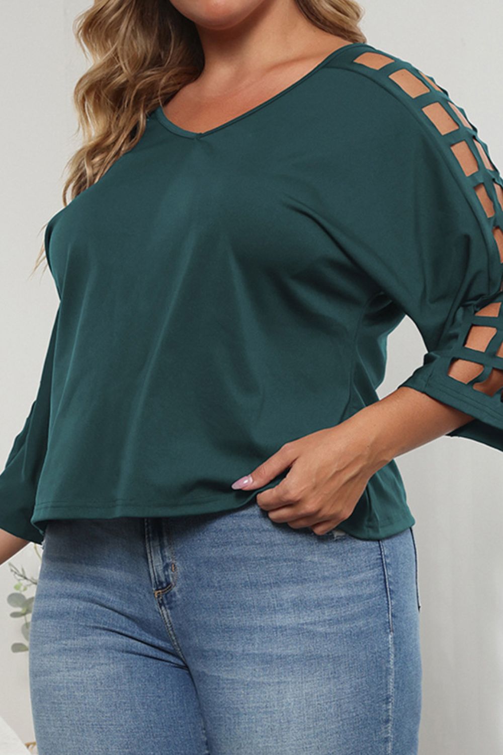 Forest green v-neck blouse with lattice cutout sleeves