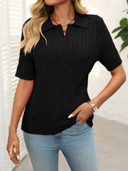 Black cable knit polo sweater with short sleeves and a collar.