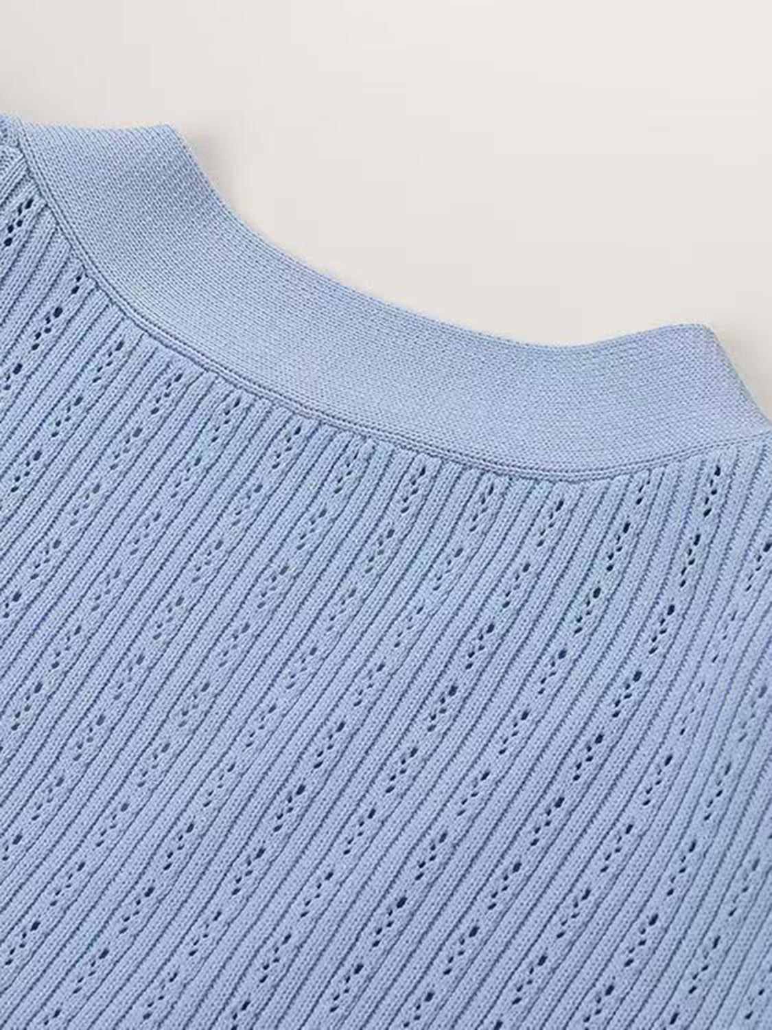 Light blue knit cardigan with openwork detail and ribbed neckline