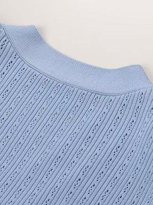 Light blue knit cardigan with openwork detail and ribbed neckline