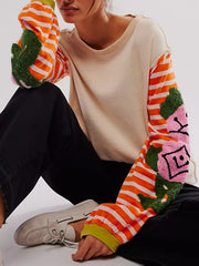 Beige tee with embroidered floral stripe sleeves