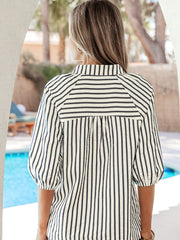 Striped blouse with puff sleeves and a collared neckline.