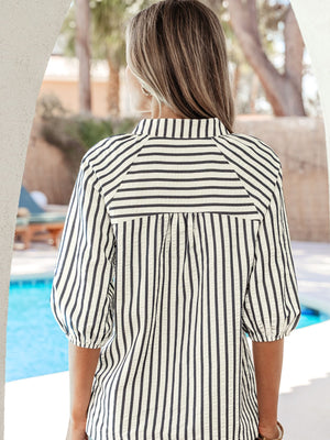 Striped blouse with puff sleeves and a collared neckline.
