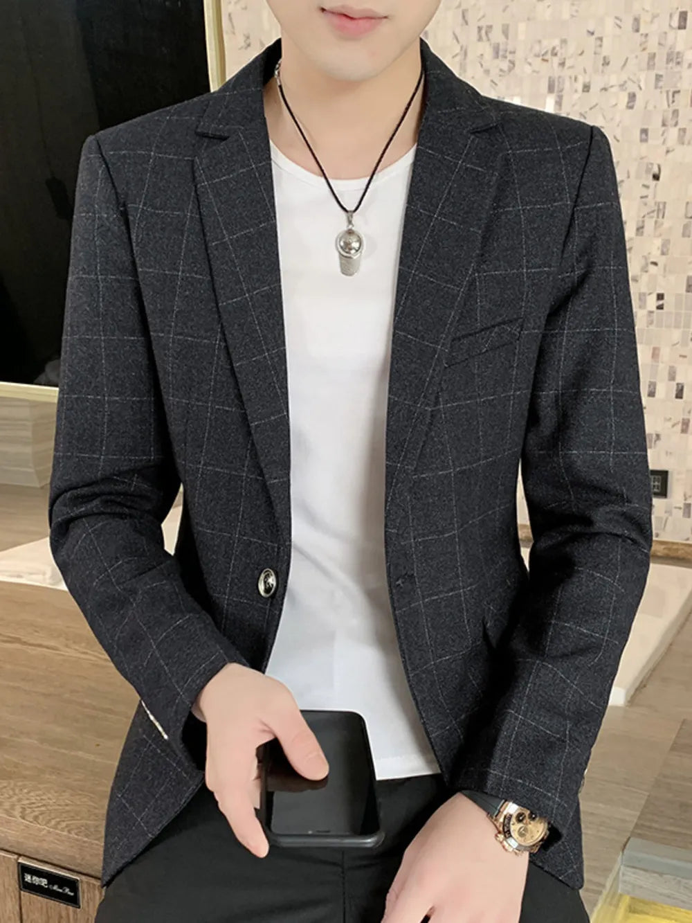 Men's dark navy plaid sport jacket with button closure and white t-shirt.