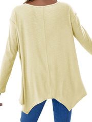 Light Yellow ribbed knit tunic with a long sleeve and asymmetric hem.