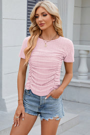 Blush pink eyelet tee with ruched front detail and crew neck.