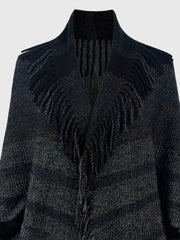 Textured black knit capelet with fringe detail and open front.