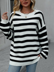 Chunky stripe relaxed fit knit sweater in black and white acrylic with crew neck and long sleeves.