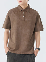 Brown cotton polo shirt with subtle texture and buttoned placket.