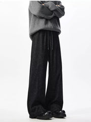 Textured black wide leg drawstring sweatpants with adjustable tie.