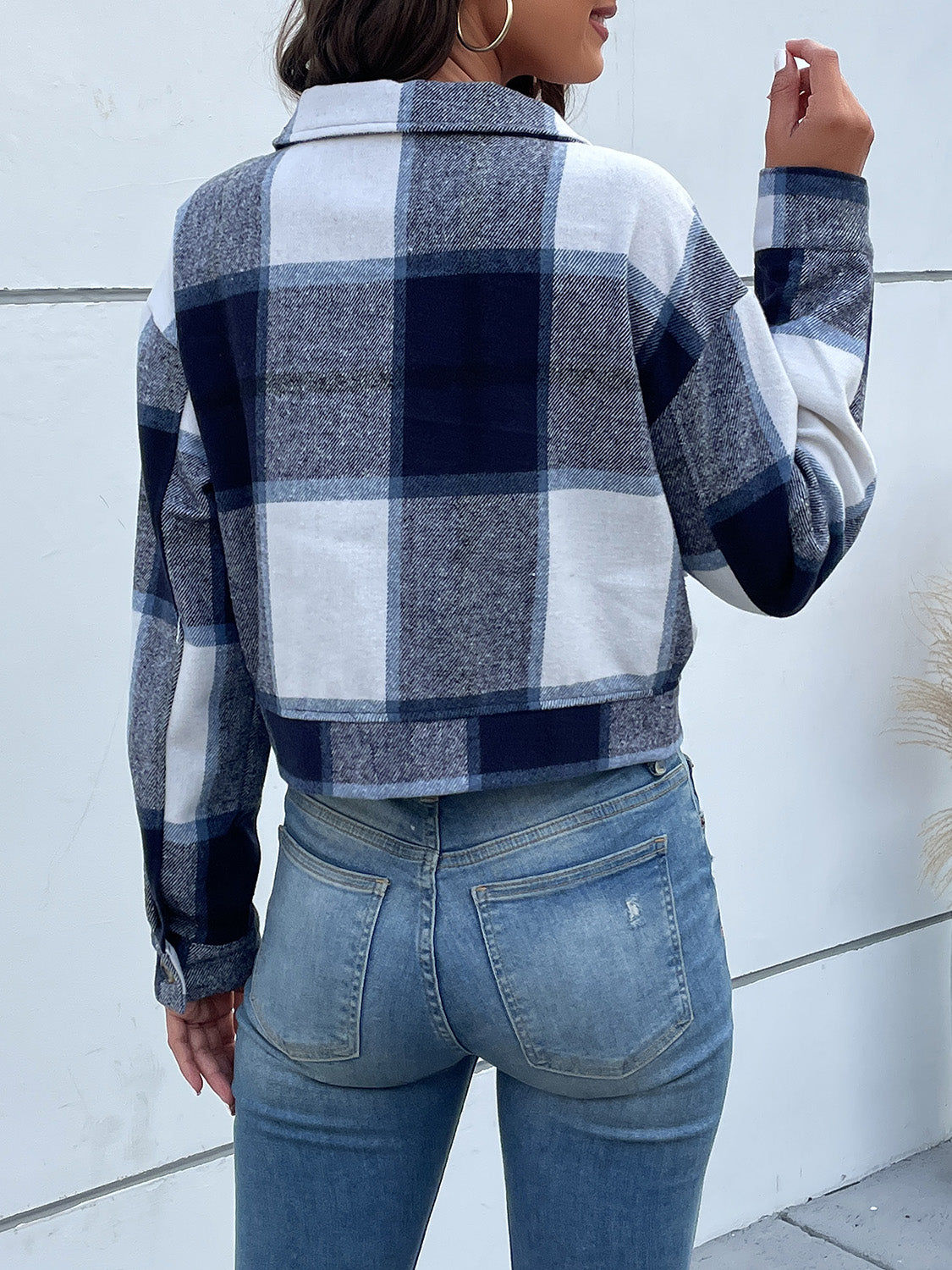 Checked plaid shacket in blue and white with buttoned cuffs and collar.