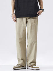 Khaki relaxed fit cargo pants with button flap pockets and a straight leg.