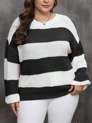 Wide stripe relaxed knit jumper in black and white acrylic with crew neck and long sleeves.