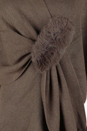 Taupe knit cape with faux fur trim detail.