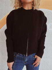 Black ribbed hemline zip-front knit top with mock neck and long sleeves.