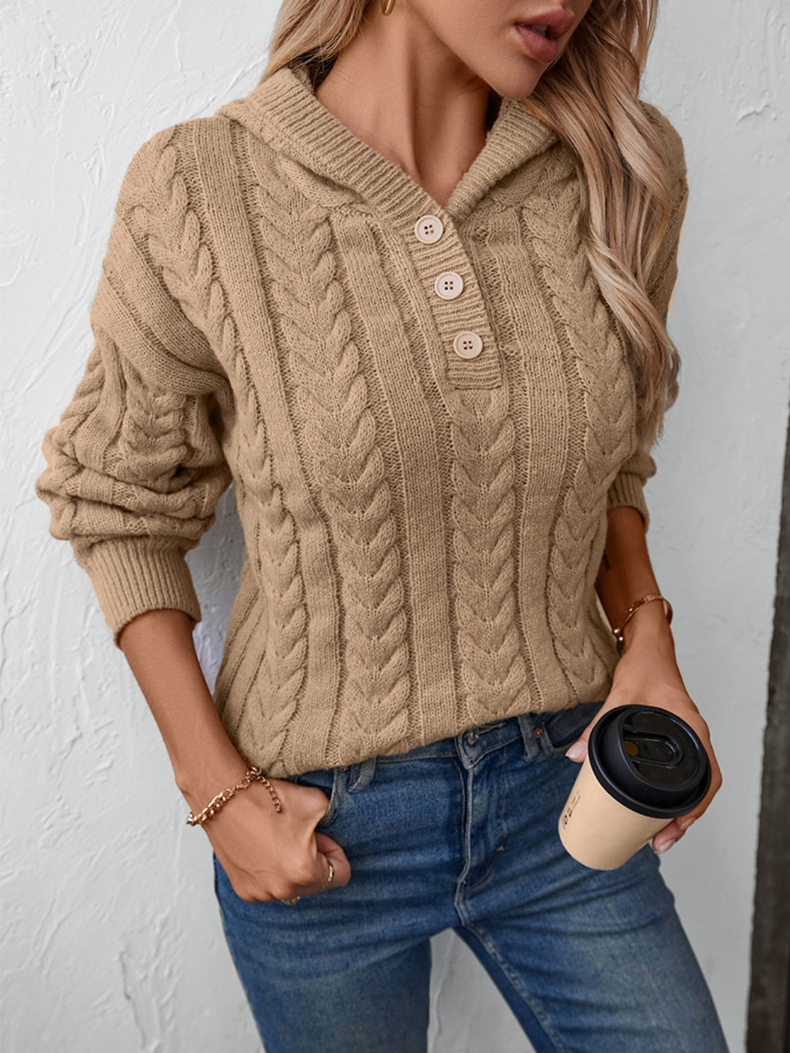 Camel cable knit hooded sweater with buttoned henley neckline.
