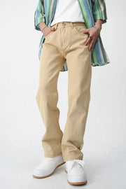 Relaxed fit khaki chino trousers with a straight leg, styled with a striped shirt and white sneakers.