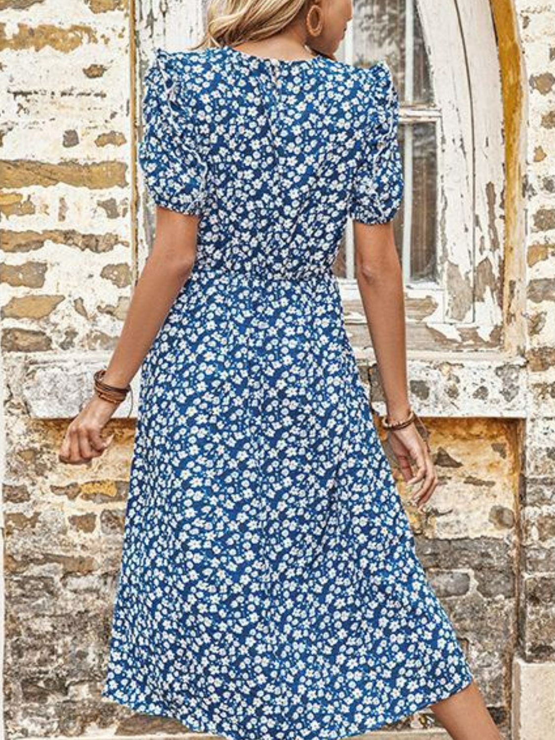 Blue floral midi dress with puff sleeves and a cinched waist