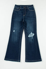 Dark wash denim widecut jeans with distressed details and rough hem