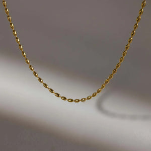 Gold capsule chain necklace with oval beads
