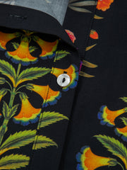 Black cotton maternity shirt with floral print, V-neck, and button detail.