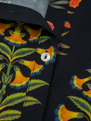 Black cotton maternity shirt with floral print, V-neck, and button detail.