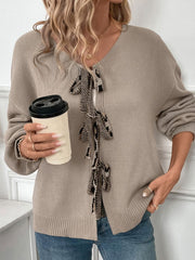 Mocha acrylic cardigan with leopard print tie-front detail and balloon sleeves.