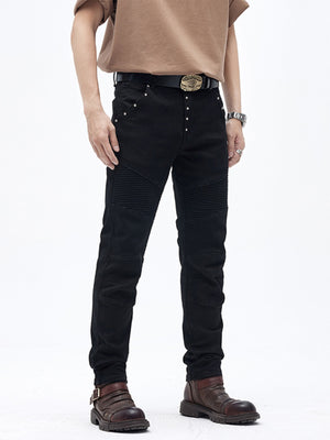 Black cotton slim fit moto jeans with ribbed panels and button fly.