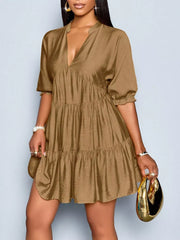 Brown tiered v-neck dress with short sleeves and ruffled cuffs.