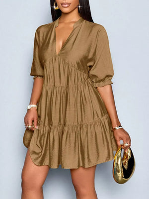 Brown tiered v-neck dress with short sleeves and ruffled cuffs.