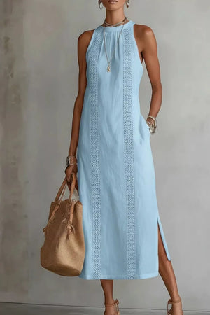 Light blue midi dress with pockets, lace trim, and side slits.