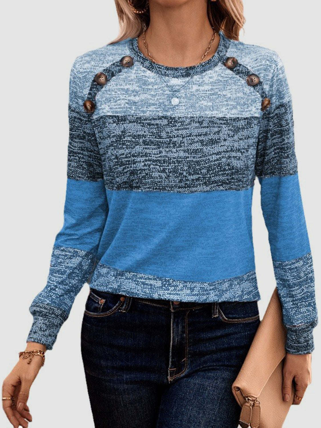 Marled stripe knit sweater in sky blue with button shoulder detail and crew neck.