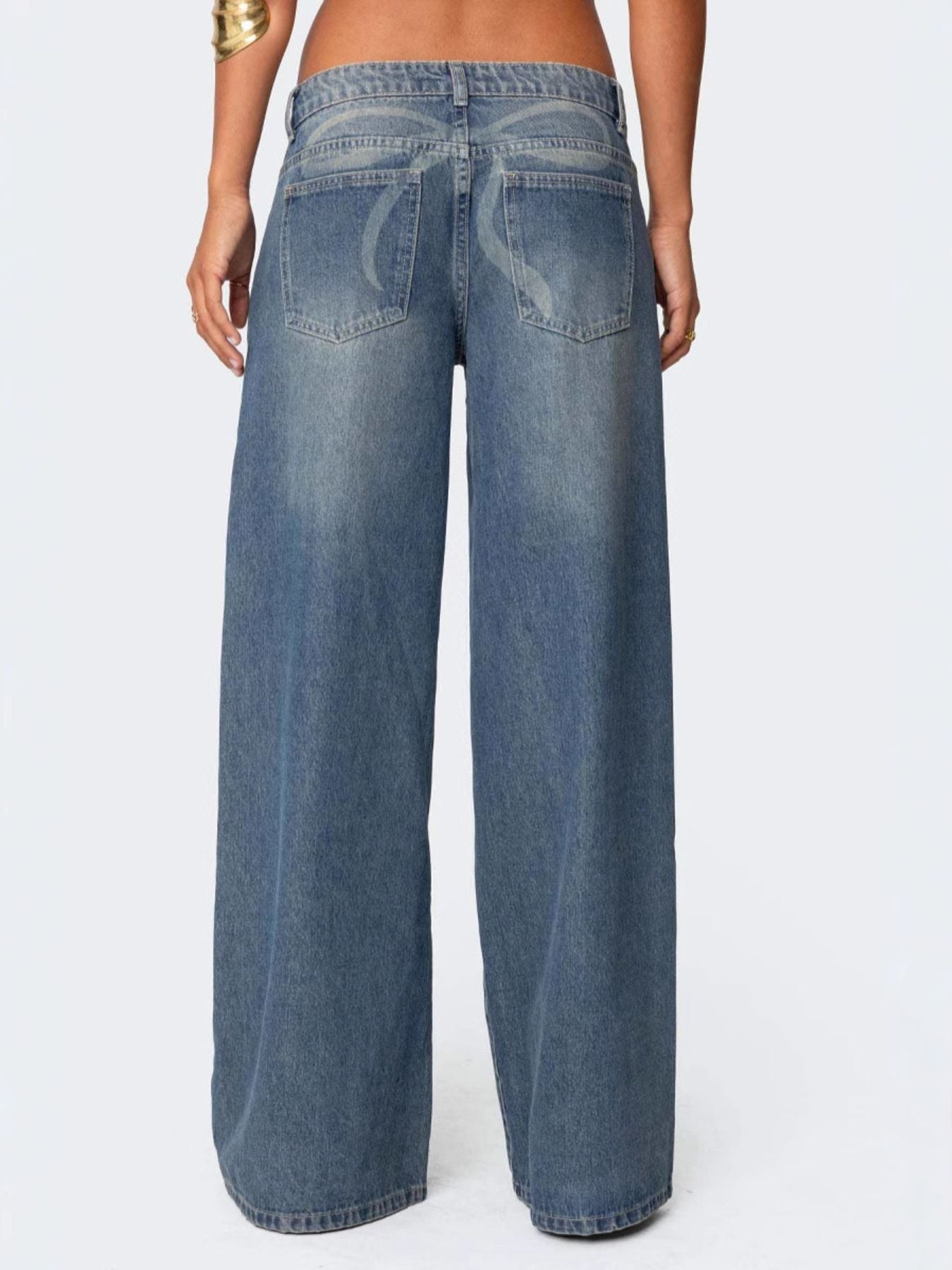 Dark blue denim wide leg jeans with subtle pocket detail and a button closure.