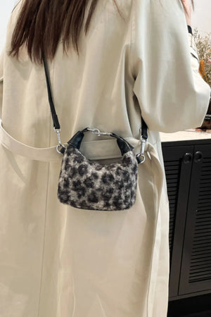 Shearling check mini shoulder bag with black trim and strap.