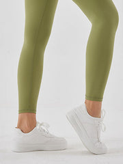 Matcha green high-waist leggings with white sneakers