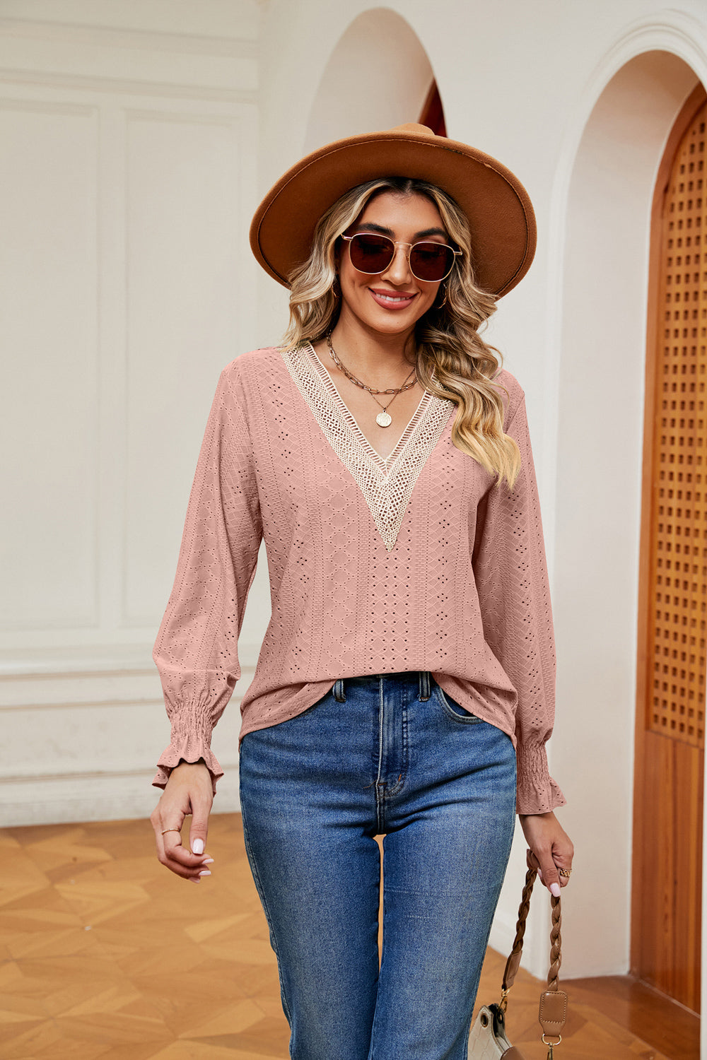Blush pink eyelet blouse with lace trim V-neck and ruffle cuffs
