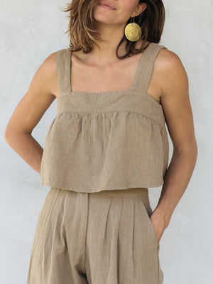 Khaki linen crop top with square neckline and culottes with pleats.