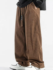 Brown corduroy wide-leg sweatpants with drawstring and pockets.