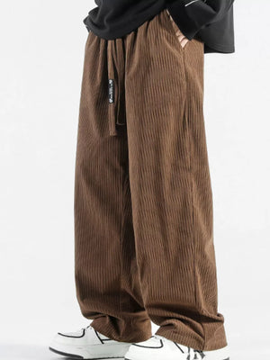 Brown corduroy wide-leg sweatpants with drawstring and pockets.