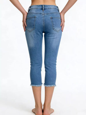Sky blue cotton capri jeans with raw hem and pockets.