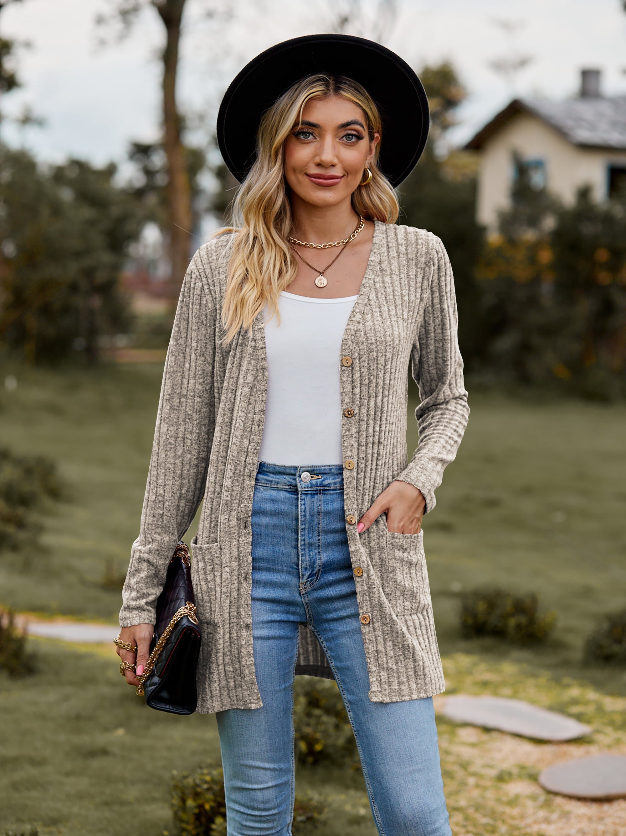 Beige longline ribbed knit button-down cardigan with pockets and a v-neck.