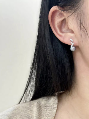Elegant sterling silver drop earrings with gray pearl and zircon details.