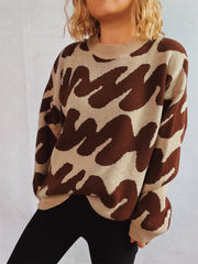Graphic wave knit sweater in camel and dark brown with a crew neck.