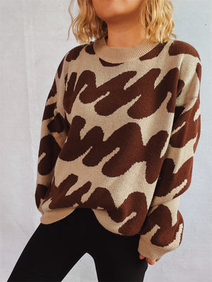 Graphic wave knit sweater in camel and dark brown with a crew neck.