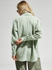 Light green textured cotton overshirt with relaxed fit and button cuffs.