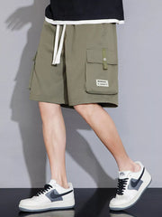 Sage green cargo shorts with white drawstring and multiple pockets.