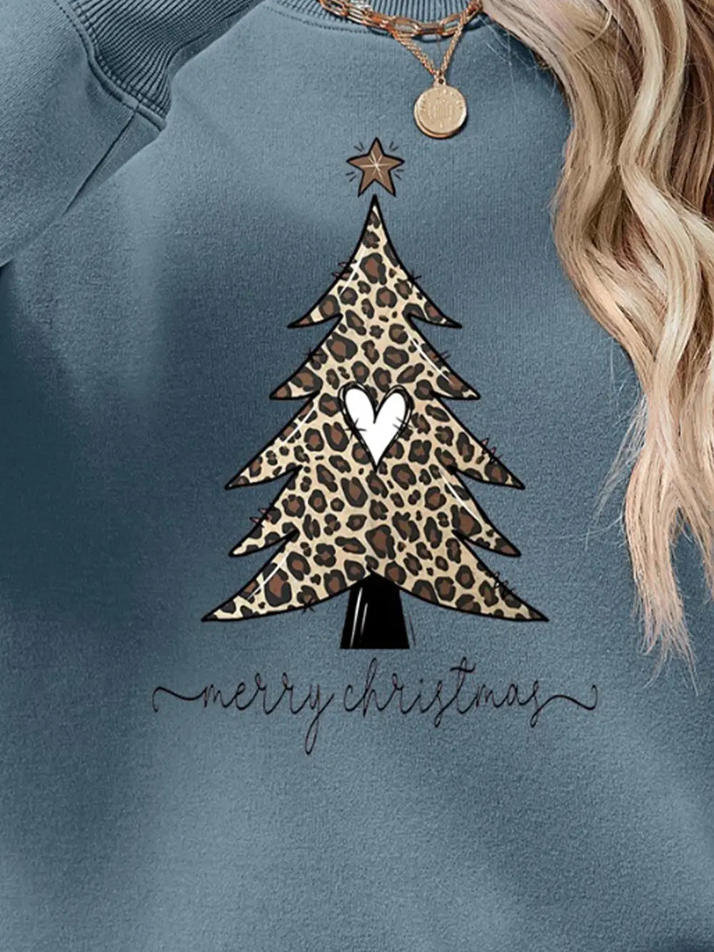 Misty Blue sweatshirt with leopard print Christmas tree graphic and "merry christmas" text.